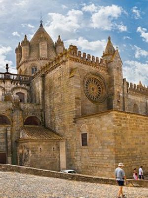 a group of people walking in front of a church